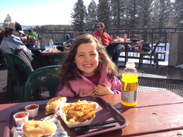 Solveig up on the ski slope with Sten enjoying lunch